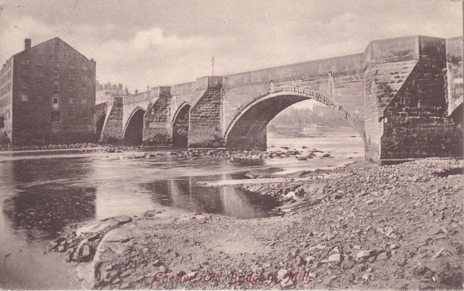 A view of the Old Dee Bridge and, the now demolished, Dee Mills.